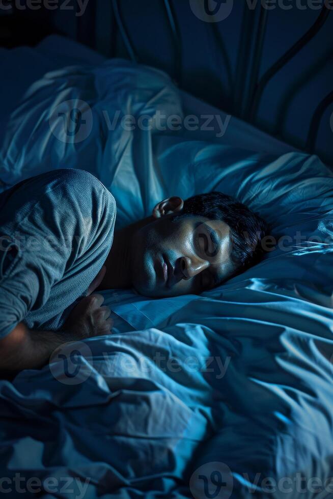 man sleeping in bed photo
