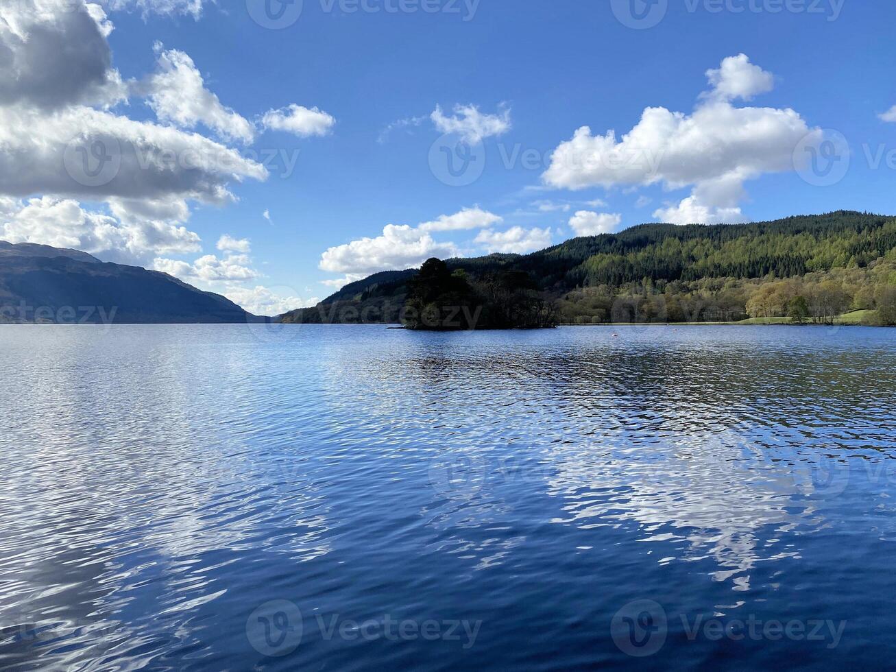 A view of Loch Lomond in Scotland on a sunny day photo