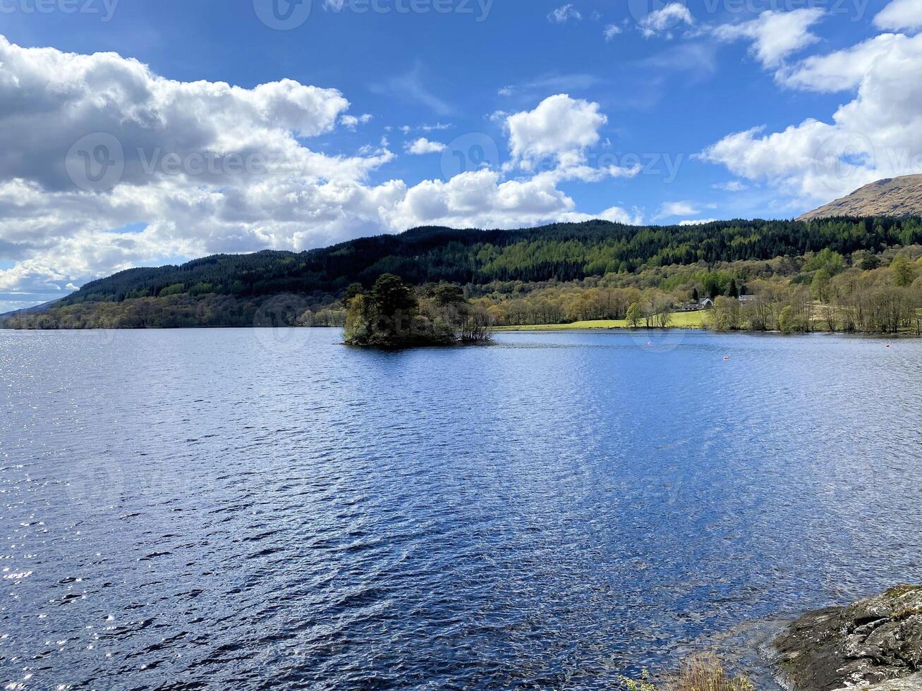A view of Loch Lomond in Scotland on a sunny day photo