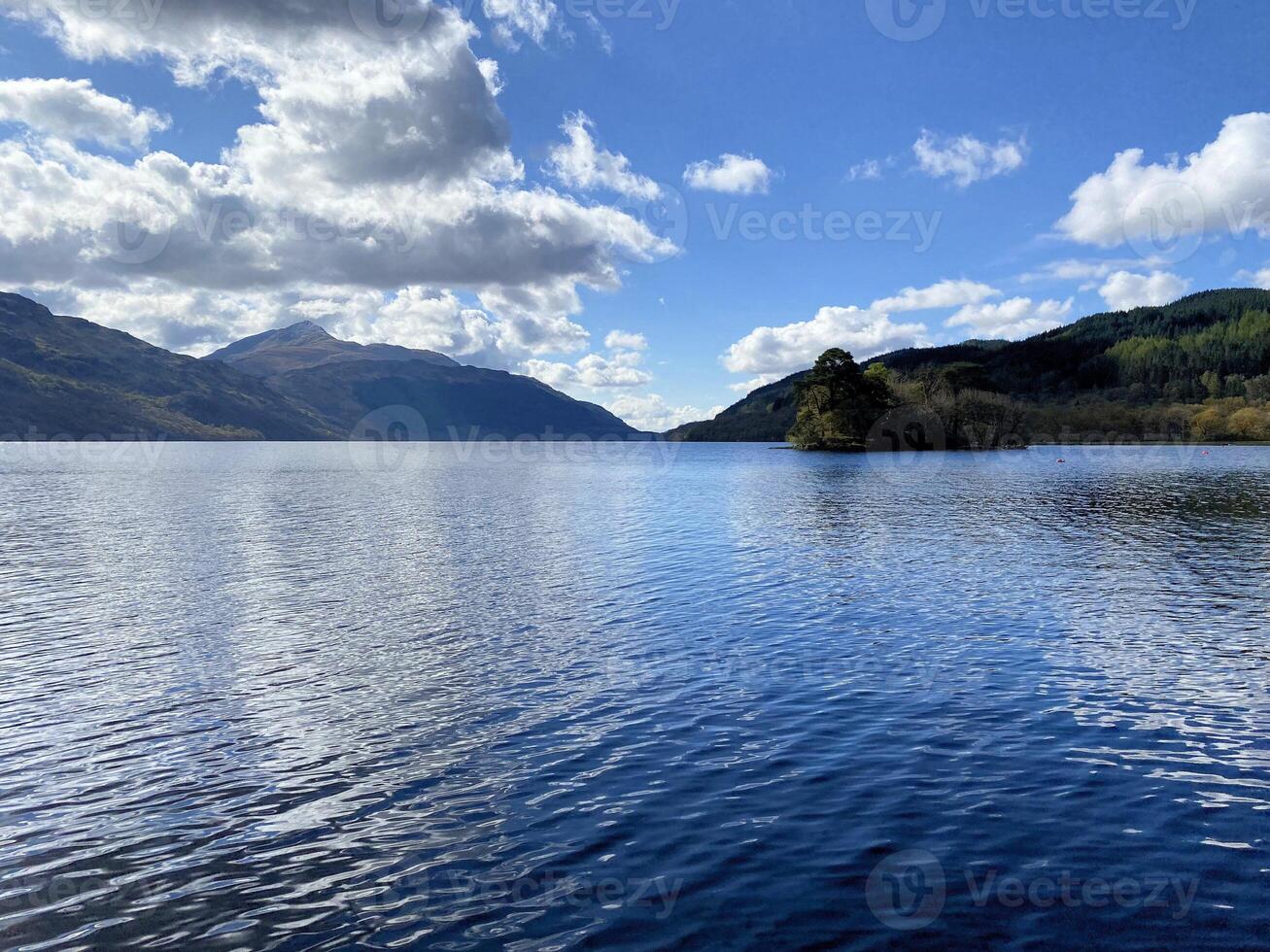 A view of Loch Lomond in Scotland on a sunny day photo