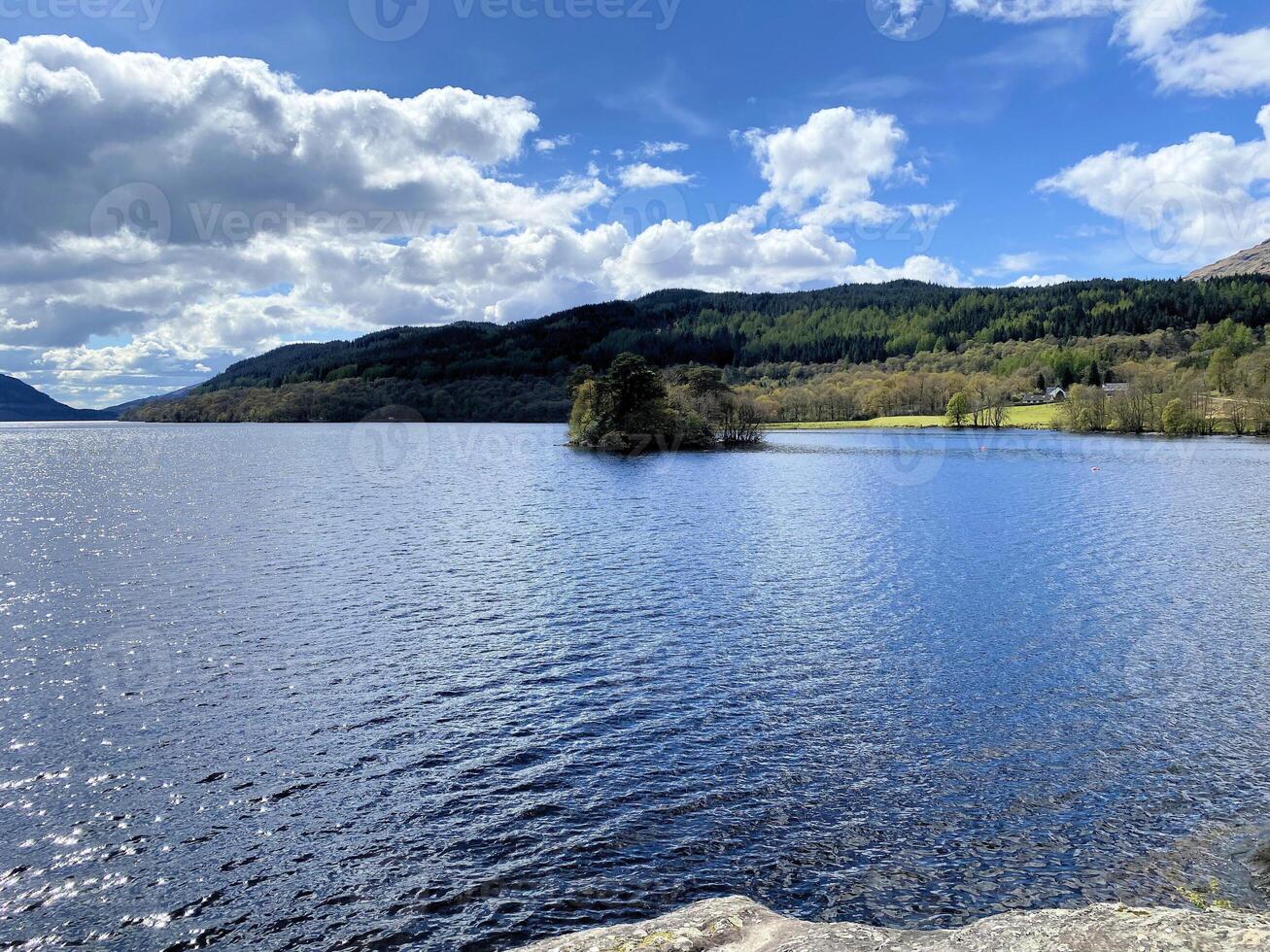 A view of Loch Lomond in Scotland on a sunny day photo
