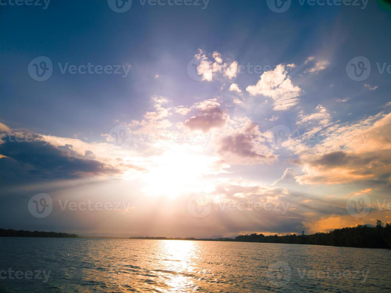 photography of landscape Sunset in the evening on the ocean photo