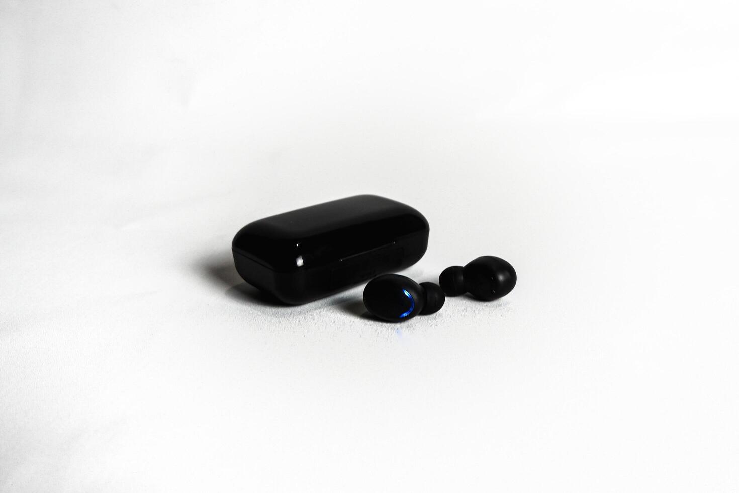 photography of a wireless bluetooth headset photo