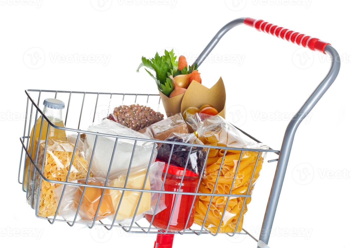 Shopping cart full with food products photo