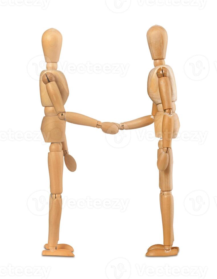 Wooden dummies shake hands photo