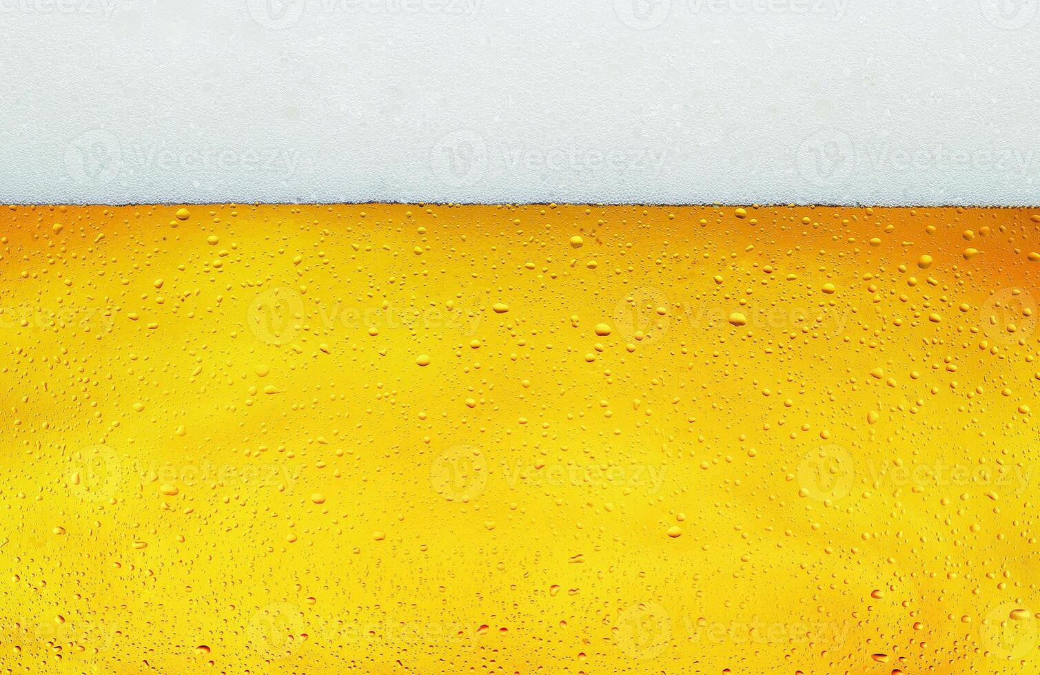 Close up background texture of lager beer with bubbles and froth in glass. photo