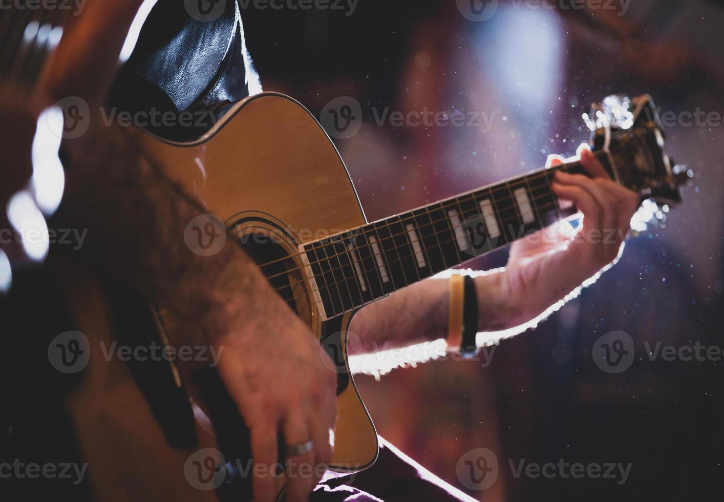 Playing classic guitar. Selective focus. photo