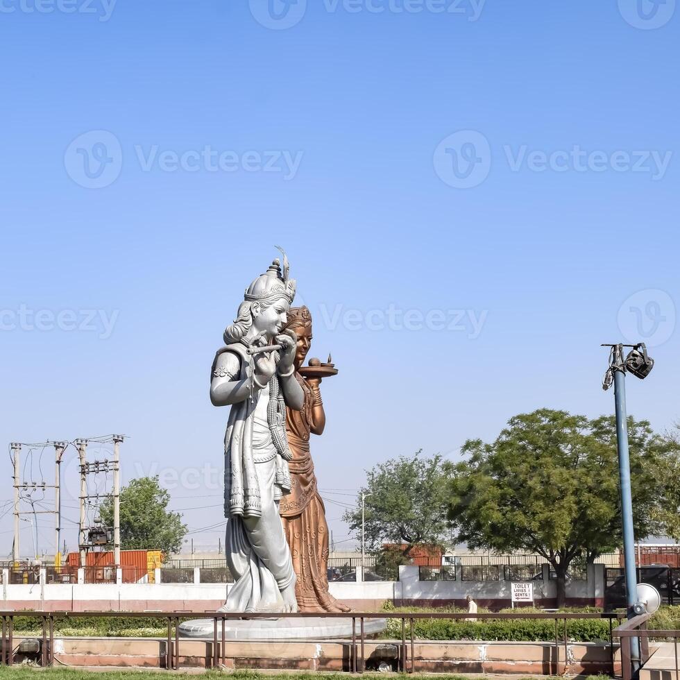 Big statue of Lord Radha Krishna near Delhi International airport, Delhi, India, Lord Krishna and Radha big statue touching sky at main highway Mahipalpur, Delhi photo