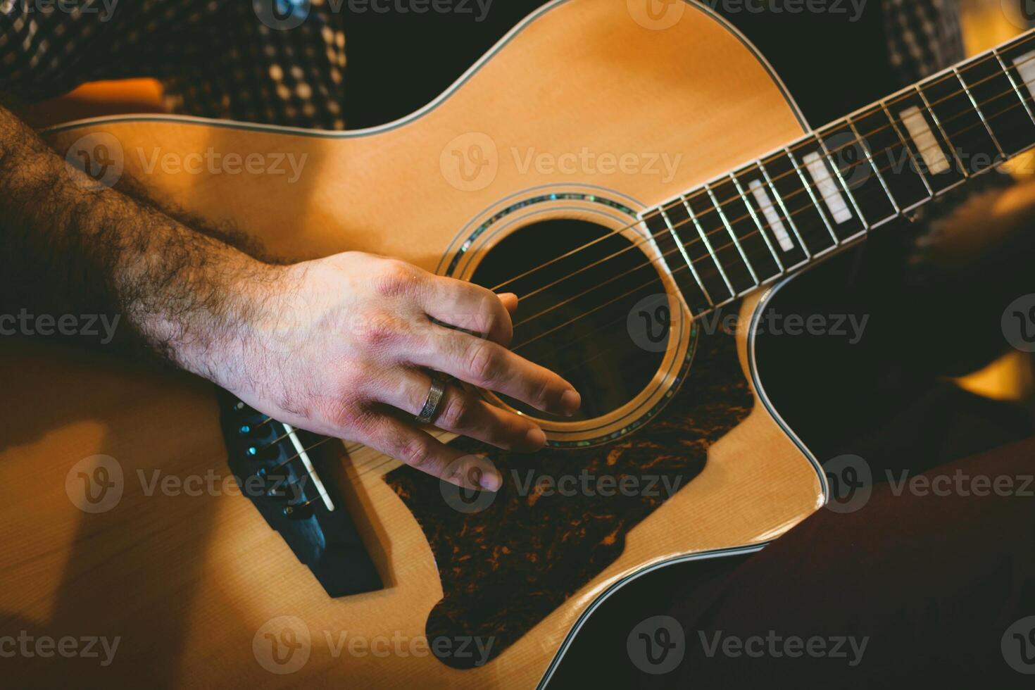 Playing classic guitar. Selective focus. photo