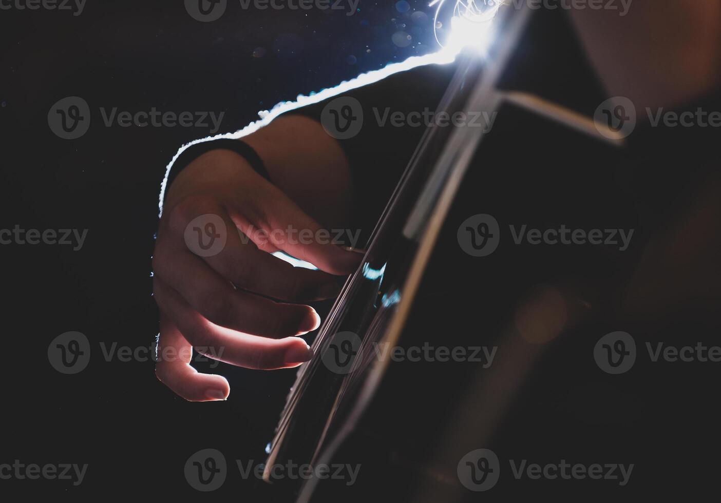 Playing classic guitar. Selective focus. photo