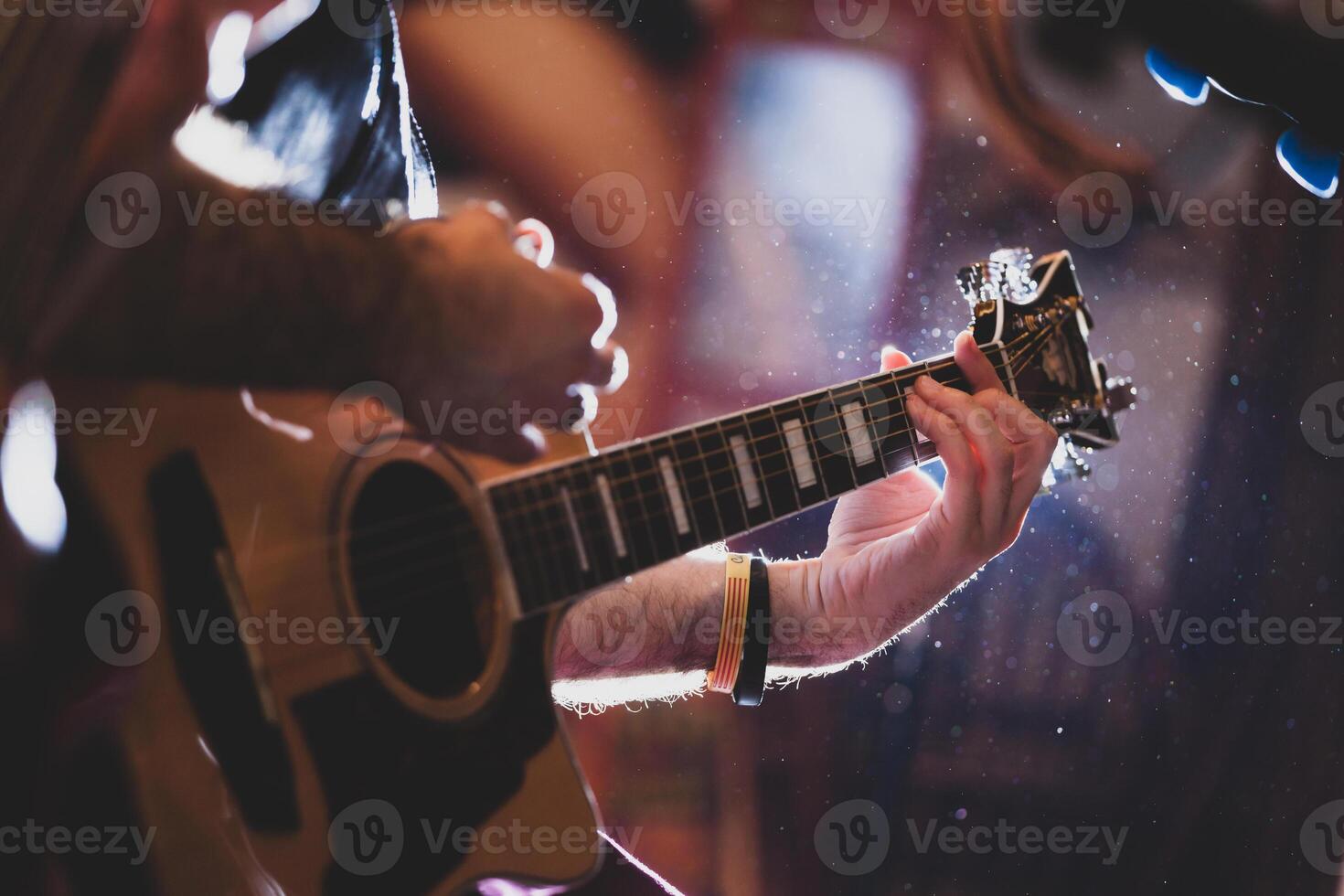 Playing classic guitar. Selective focus. photo