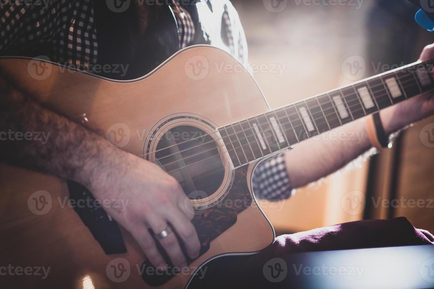 Playing classic guitar. Selective focus. photo