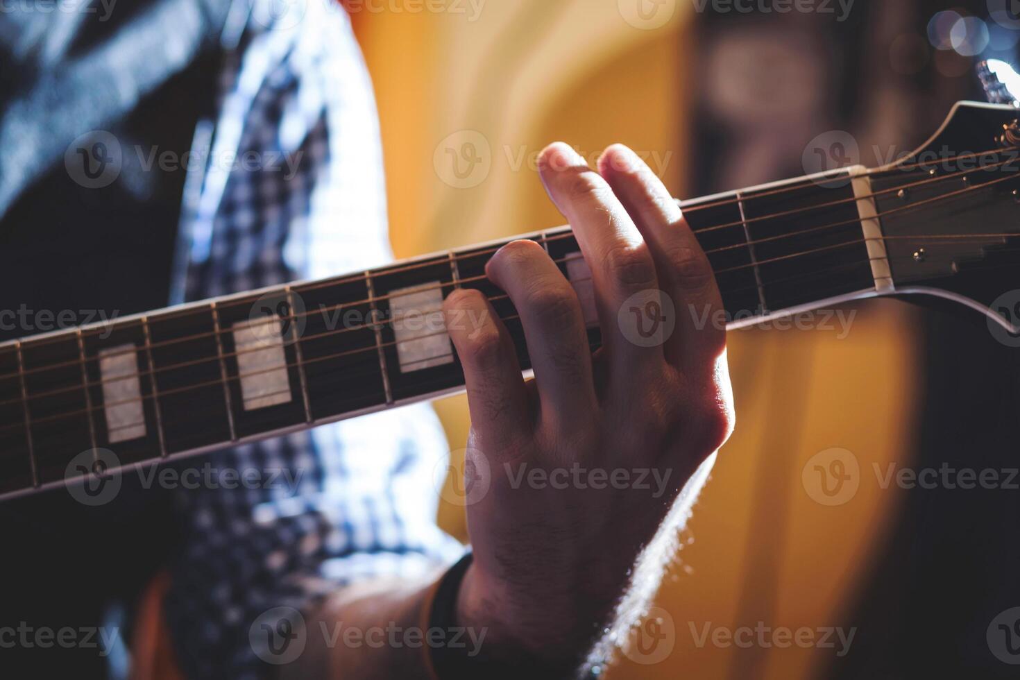 Playing classic guitar. Selective focus. photo