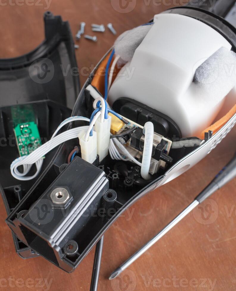 Vacuum cleaner disassembled for repair malfunctioning photo