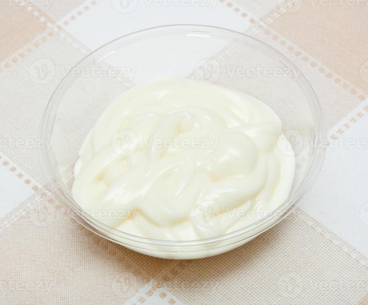 Pot with bechamel sauce photo