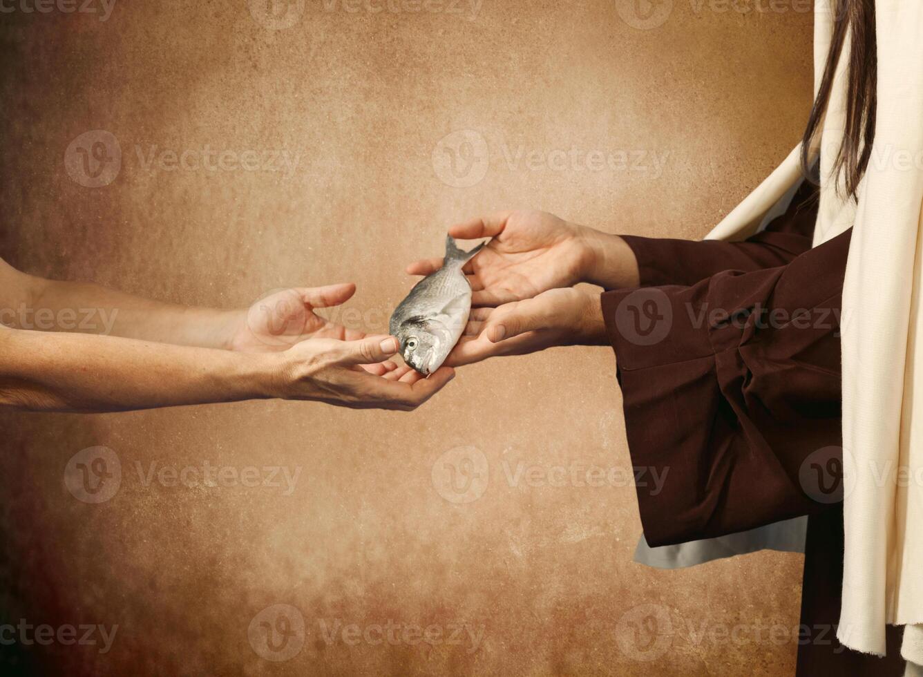 Jesus gives the fish to a beggar photo