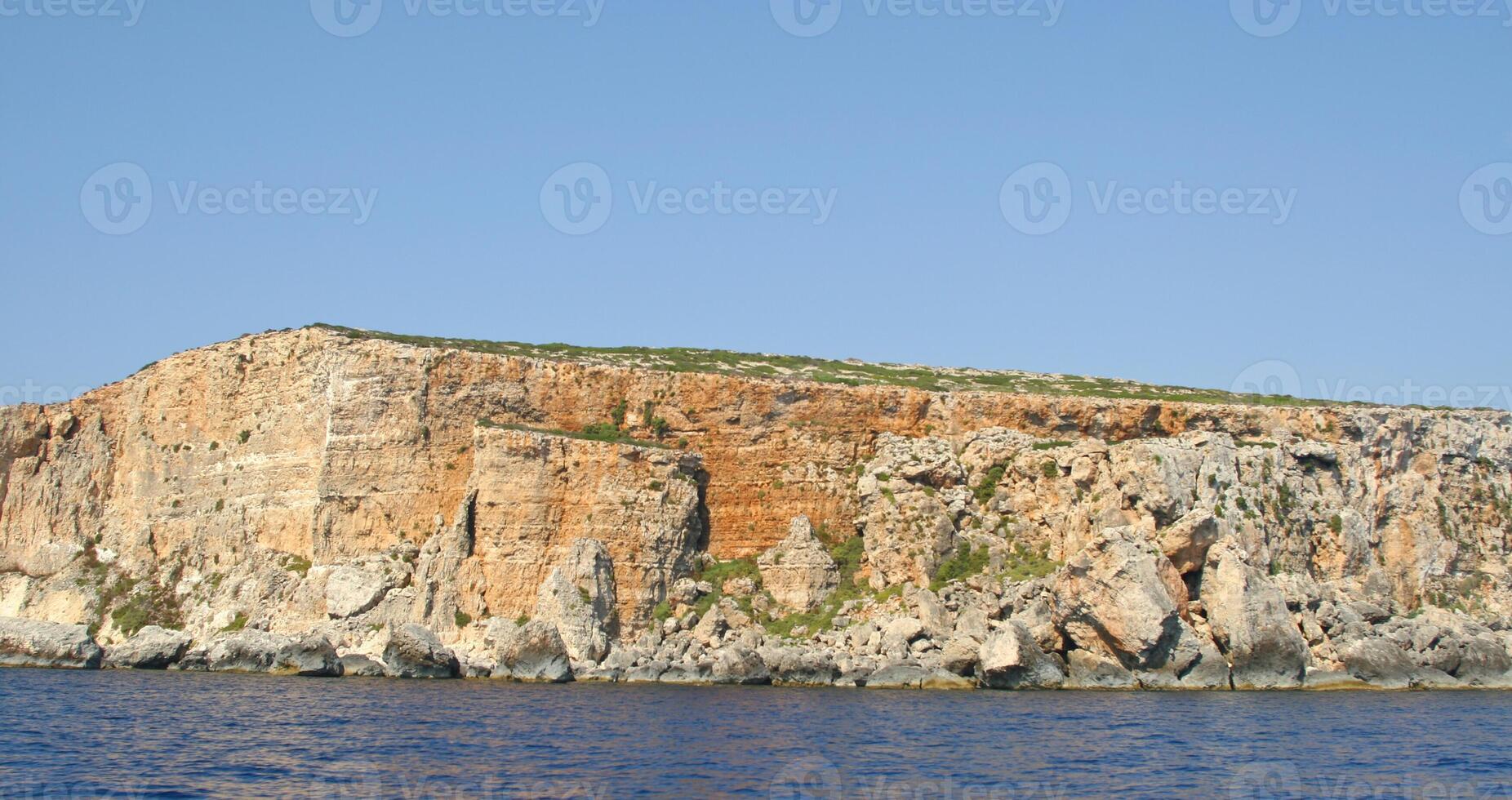 View of Coastline with generic rock, Gozo, Malta photo