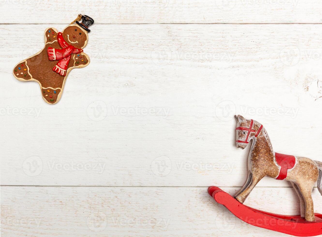 Christmas frame with gingerbread man and rocking horse. photo