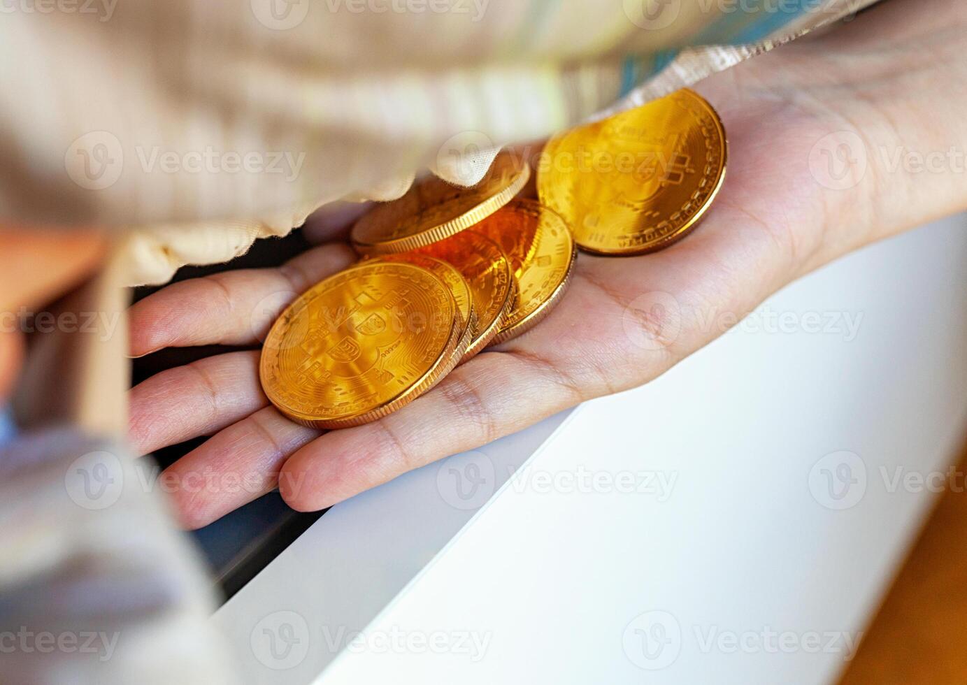 Bitcoin coins hidden under the mattress. photo