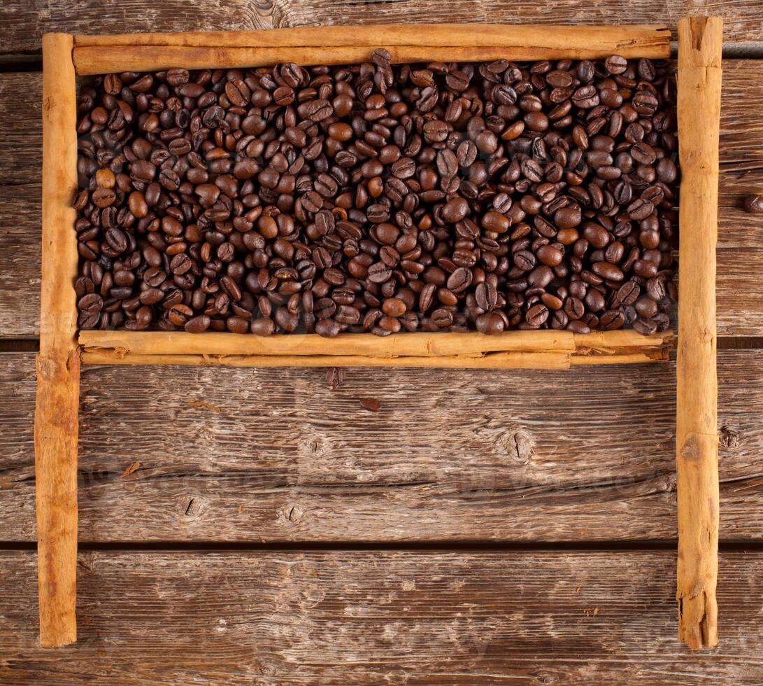 Frame with coffee beans and ceylon cinnamon photo