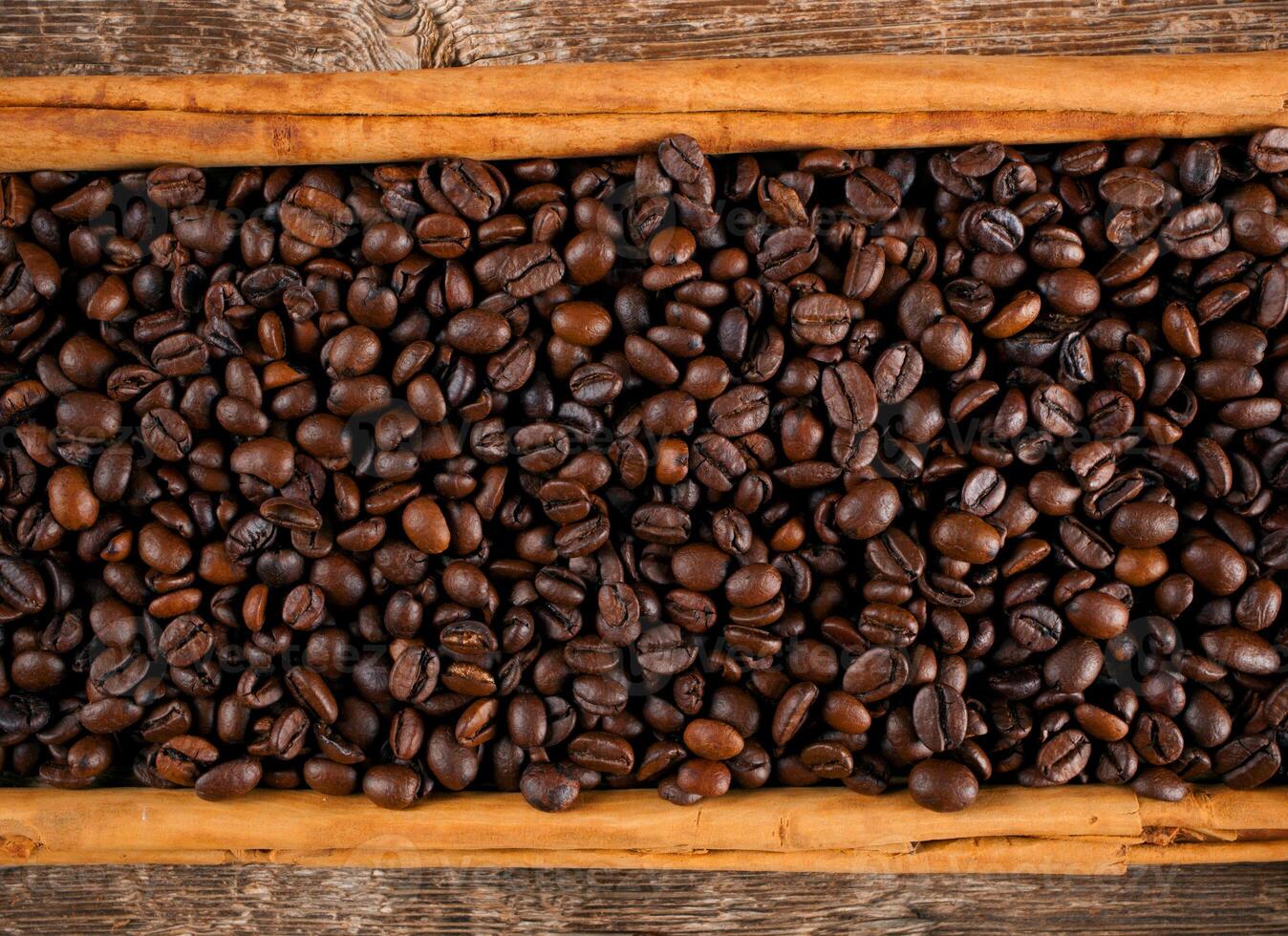 Frame with coffee beans and ceylon cinnamon photo