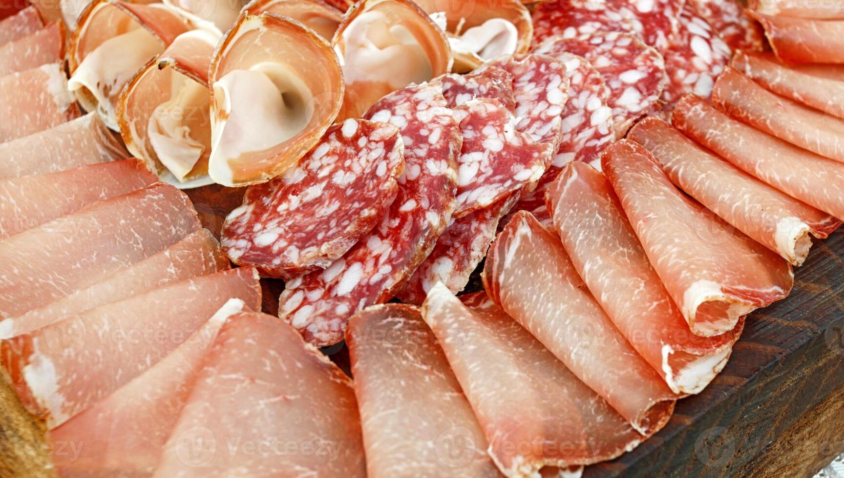 Platter of Italian cold cuts, coppa, salami and raw ham. photo