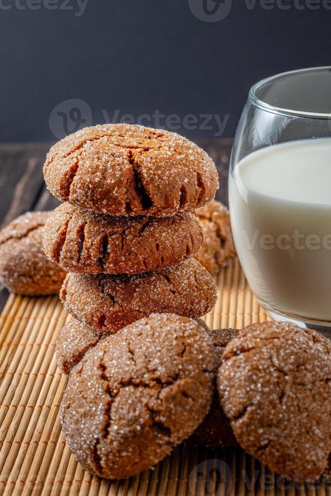 Warm Homemade Gingersnap Cookies gray towel and milk photo