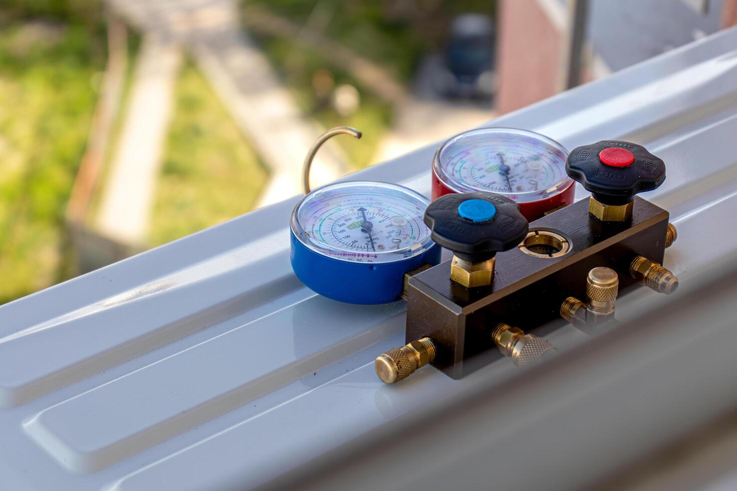 Air conditioning, HVAC service technician using gauges Lviv Ukraine 08.04.24 photo