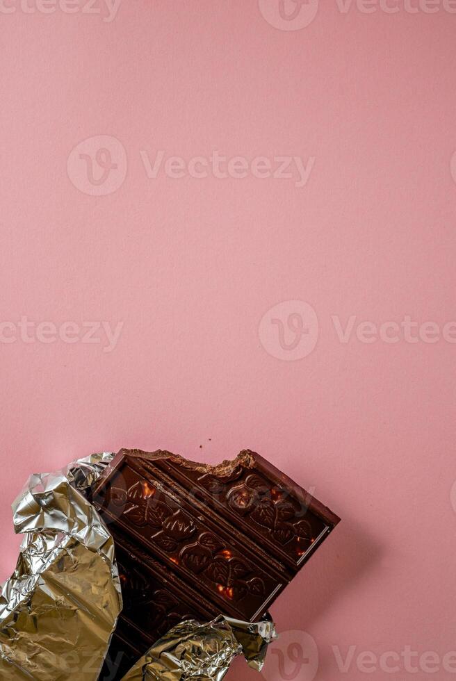 Chocolate bar pieces. Background with chocolate. Sweet food photo concept.