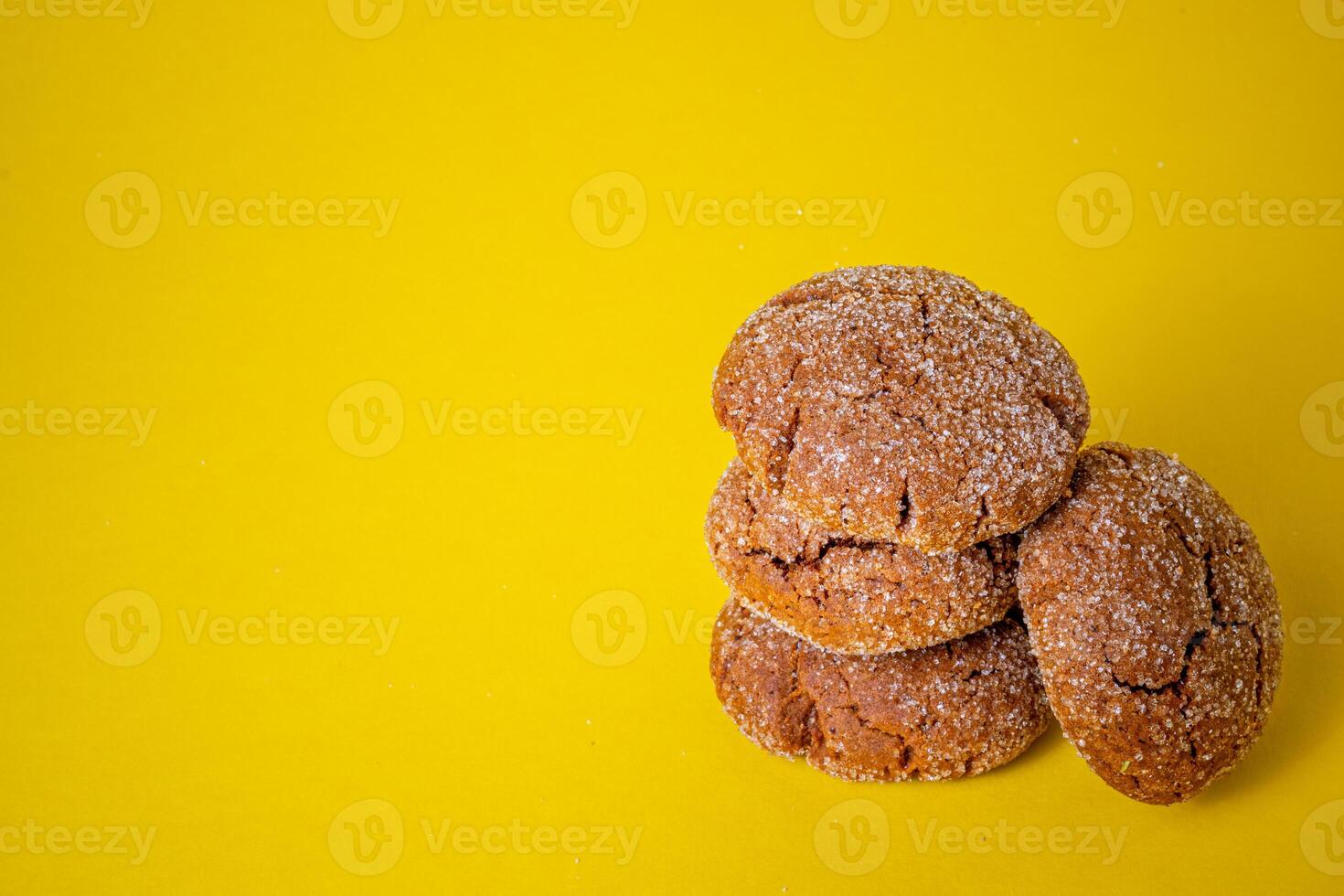 Warm Homemade Gingersnap Cookies yellow background photo