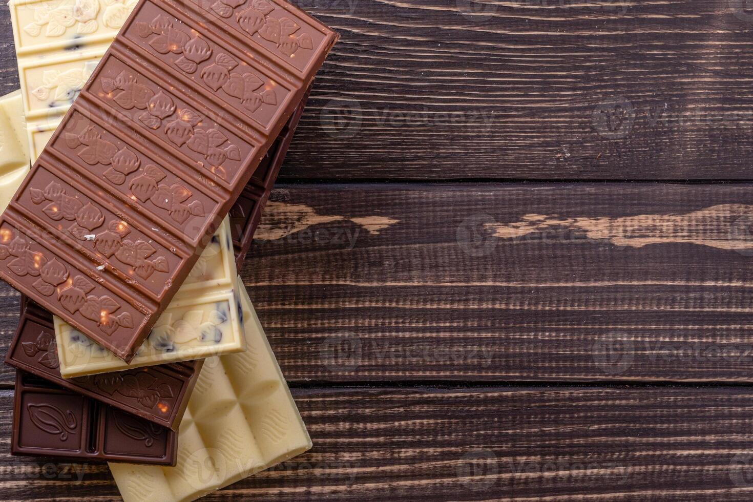 Chocolate bar pieces. Background with chocolate. Sweet food photo concept.