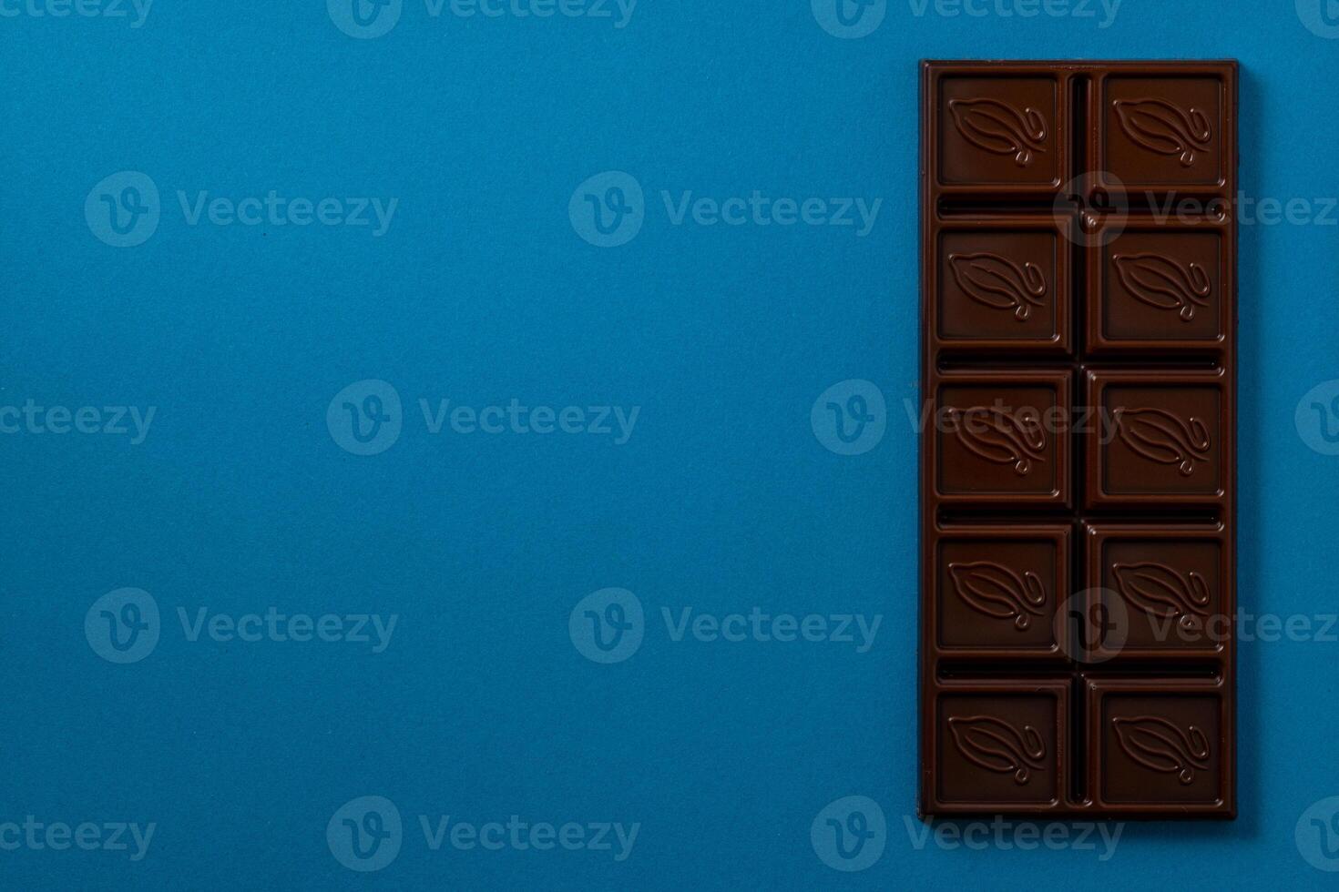 Chocolate bar pieces. Background with chocolate. Sweet food photo concept.