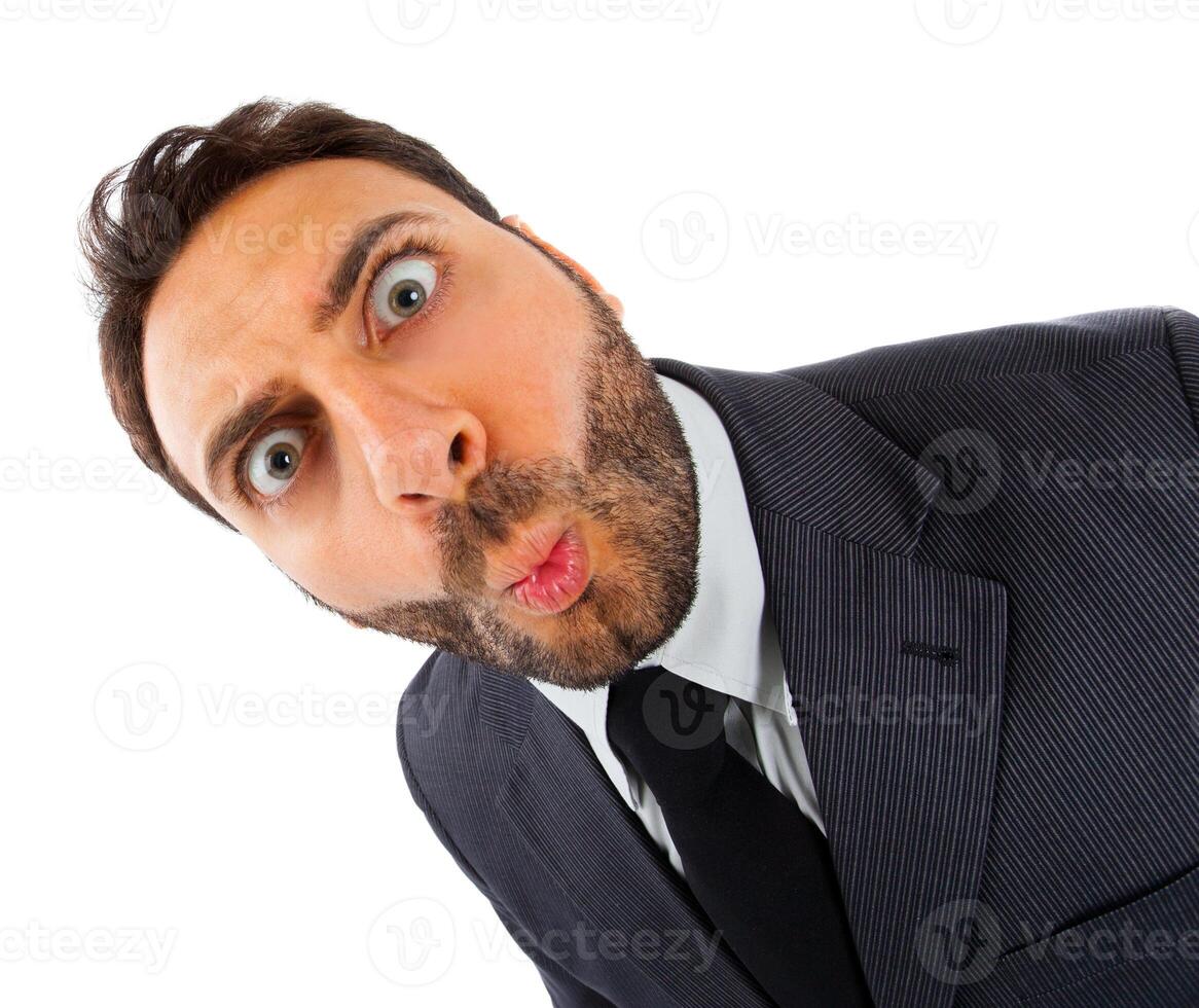 a man in a suit and tie making a funny face photo