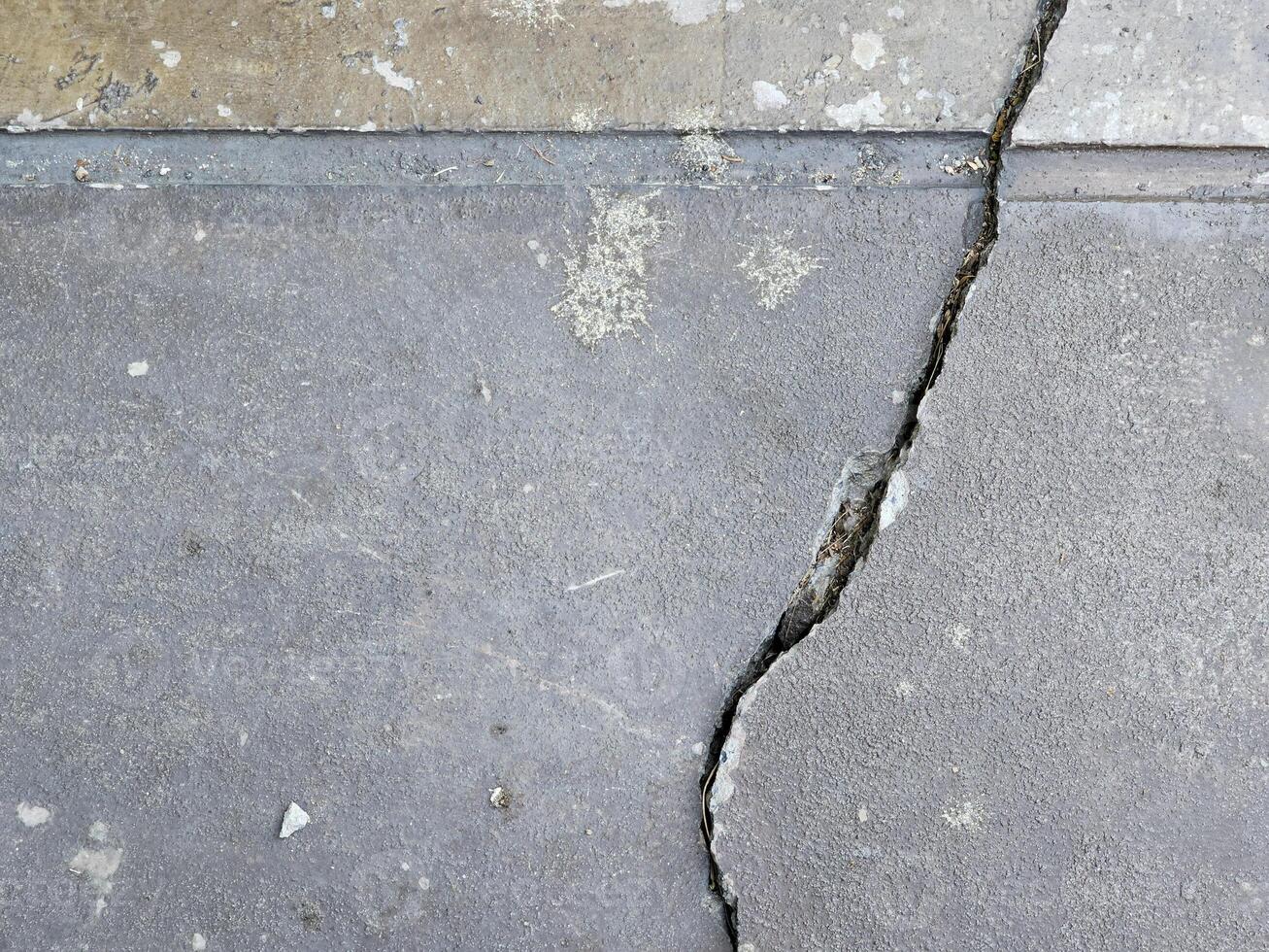 Cracked floor concrete broken and collapsed wall that effected with earthquake and collapsed ground photo