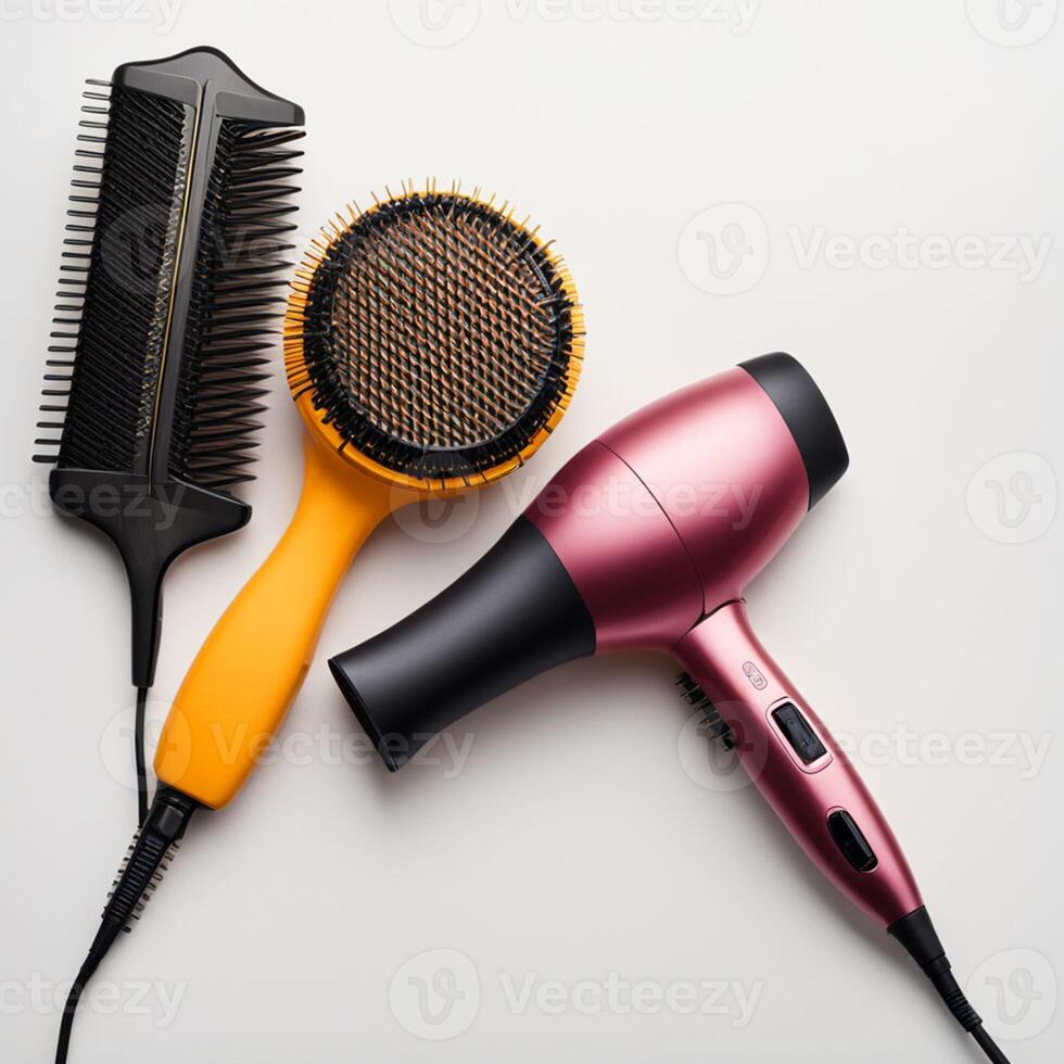 Comb brushes and hair dryer on a white background, top view photo