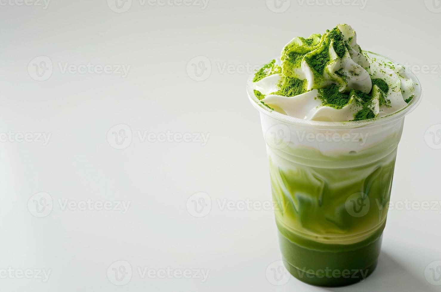 Glass of cold matcha with whipped cream on white background photo