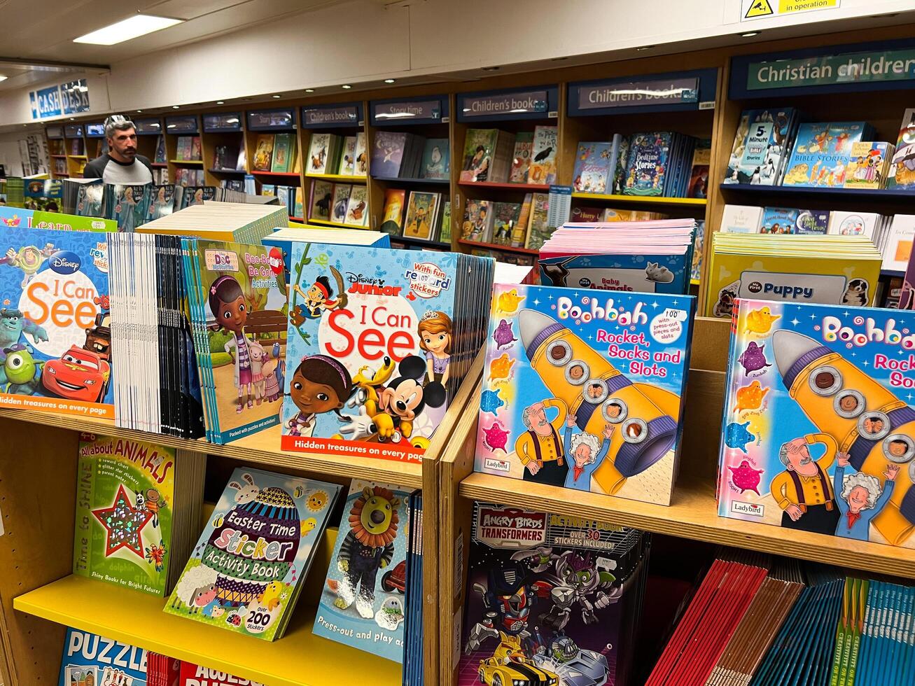 Herceg-Novi, Montenegro - 17 august 2023. Colorful educational picture books and comics stand on the shelves in a bookstore photo