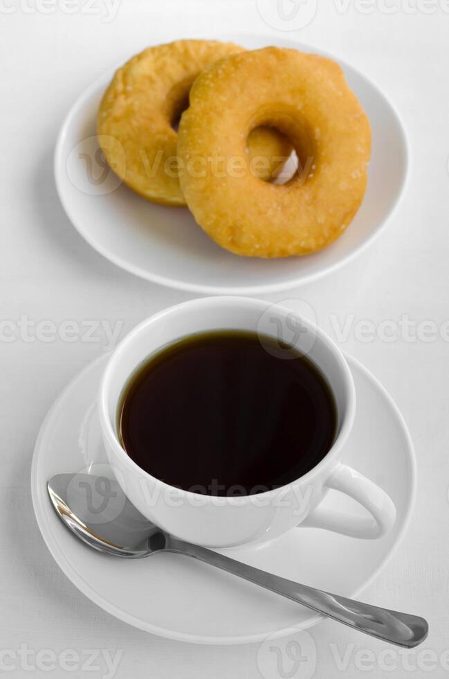 Cup of Tea and Doughnuts for Eating on Relaxing Time photo