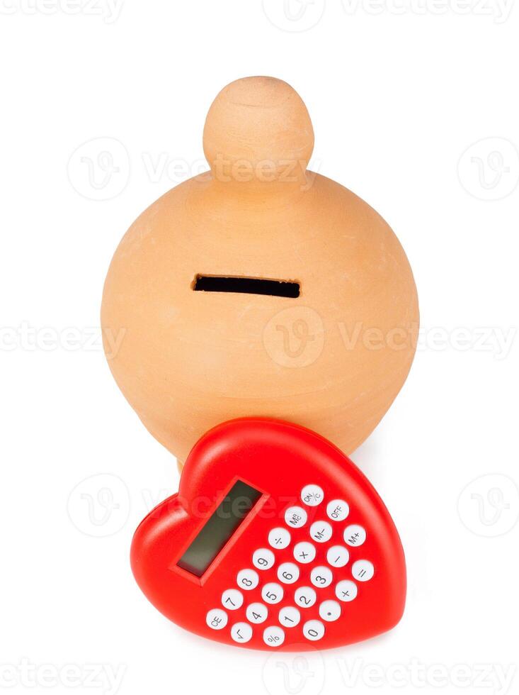 Calculator and heart shaped pacifier. photo