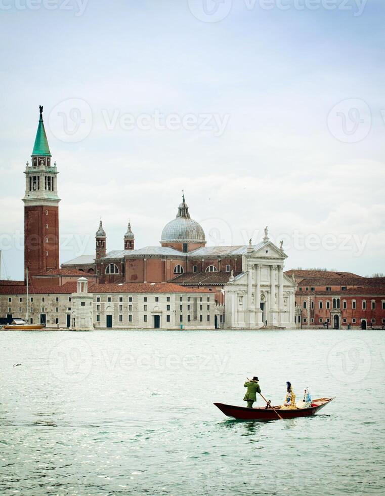 Cathedral of San Giorgio Maggiore with gondola for carnival. photo