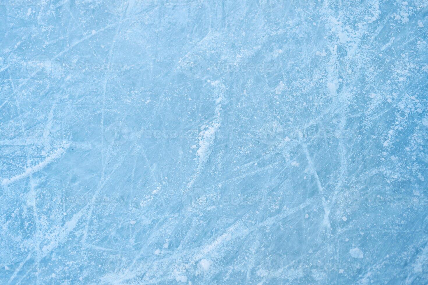 Ice rink background with visible traces of skating photo