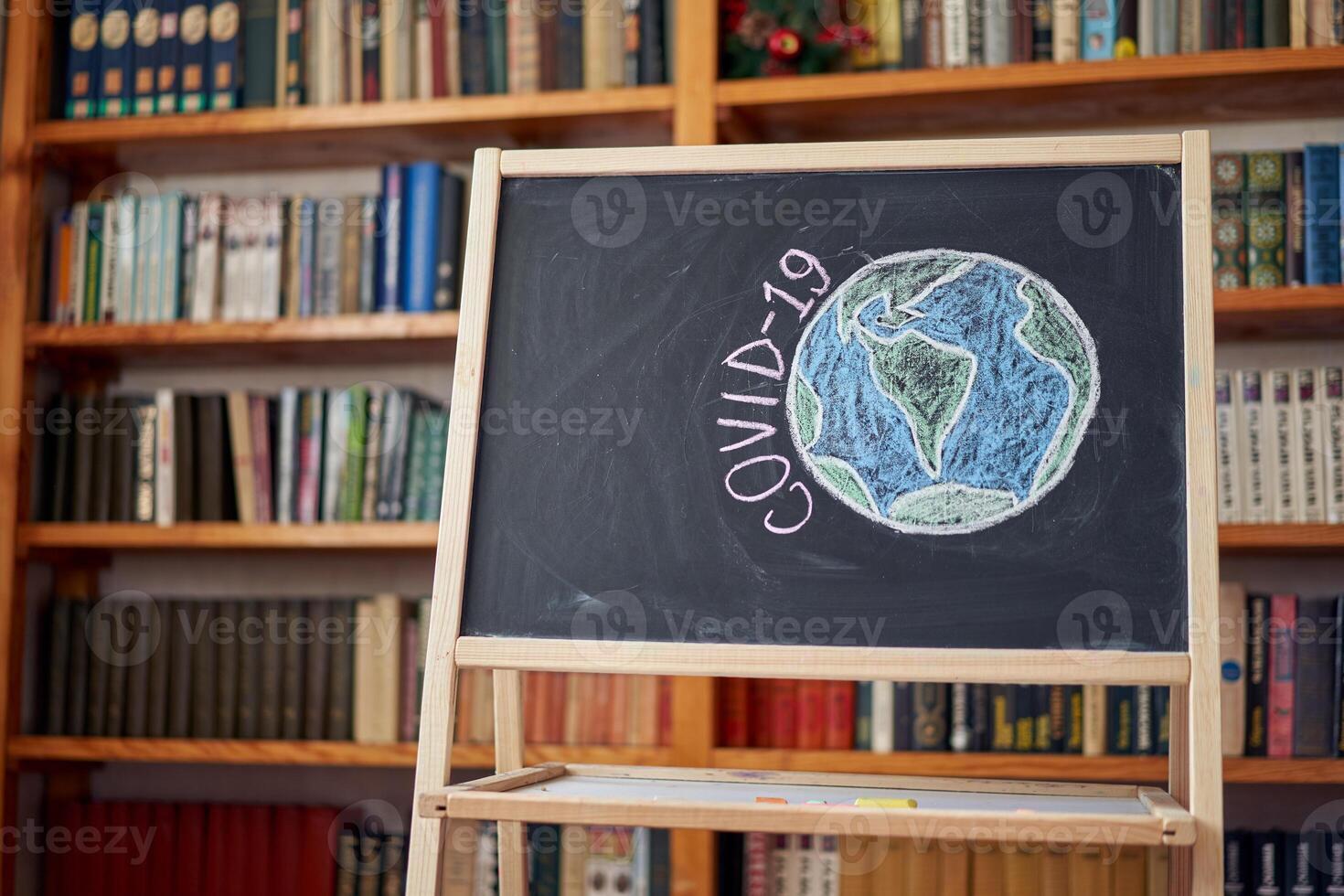inscription stay at home. Outbreak Warning. written white chalk on blackboard in connection with epidemic of coronavirus worldwide. photo
