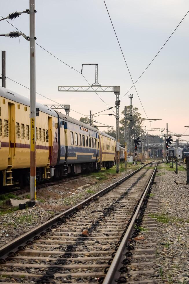 Amritsar, India, February 03 2024 - Indian railway train at Amritsar railway station platform during morning time, Colourful train at Amritsar, Punjab railway station photo