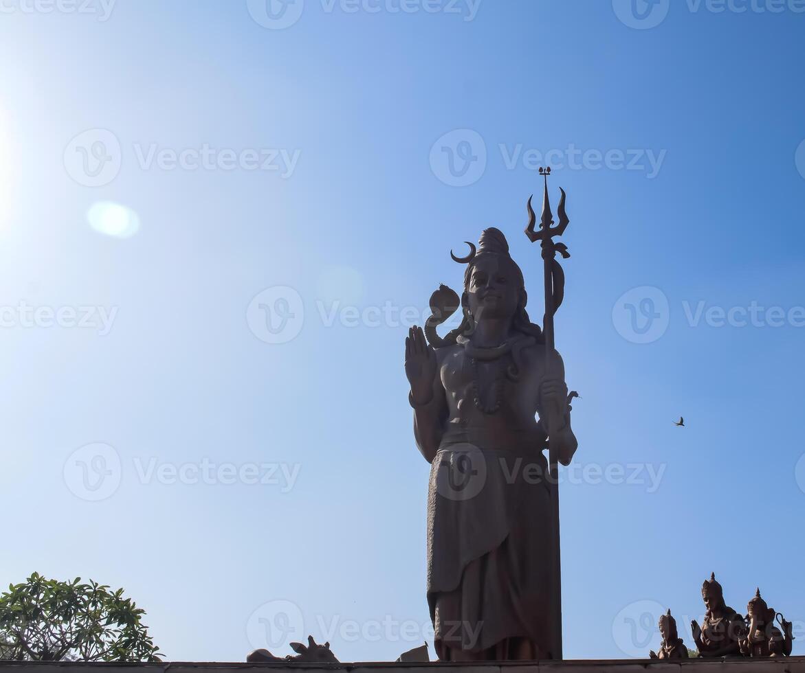 Big statue of Lord Shiva near Delhi International airport, Delhi, India, Lord Shiv big statue touching sky at main highway Mahipalpur, Delhi photo