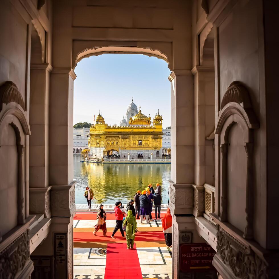 Amritsar, India - February 26 2024 -Unidentified devotees from various parts at Golden Temple - Harmandir Sahib in Amritsar, Punjab, India, Famous indian sikh landmark, Golden Temple photo
