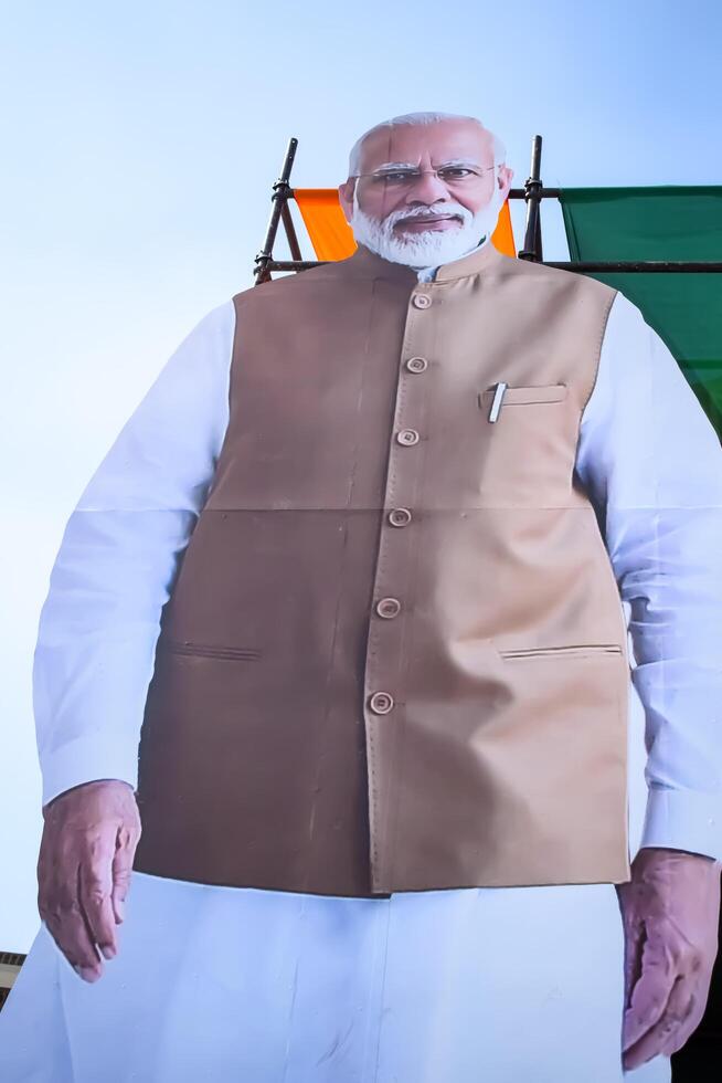 New Delhi, India - February 17 2024 - Prime Minister Narendra Modi cut out during BJP road show, the poster of PM Modi while attending a big election rally in the capital photo