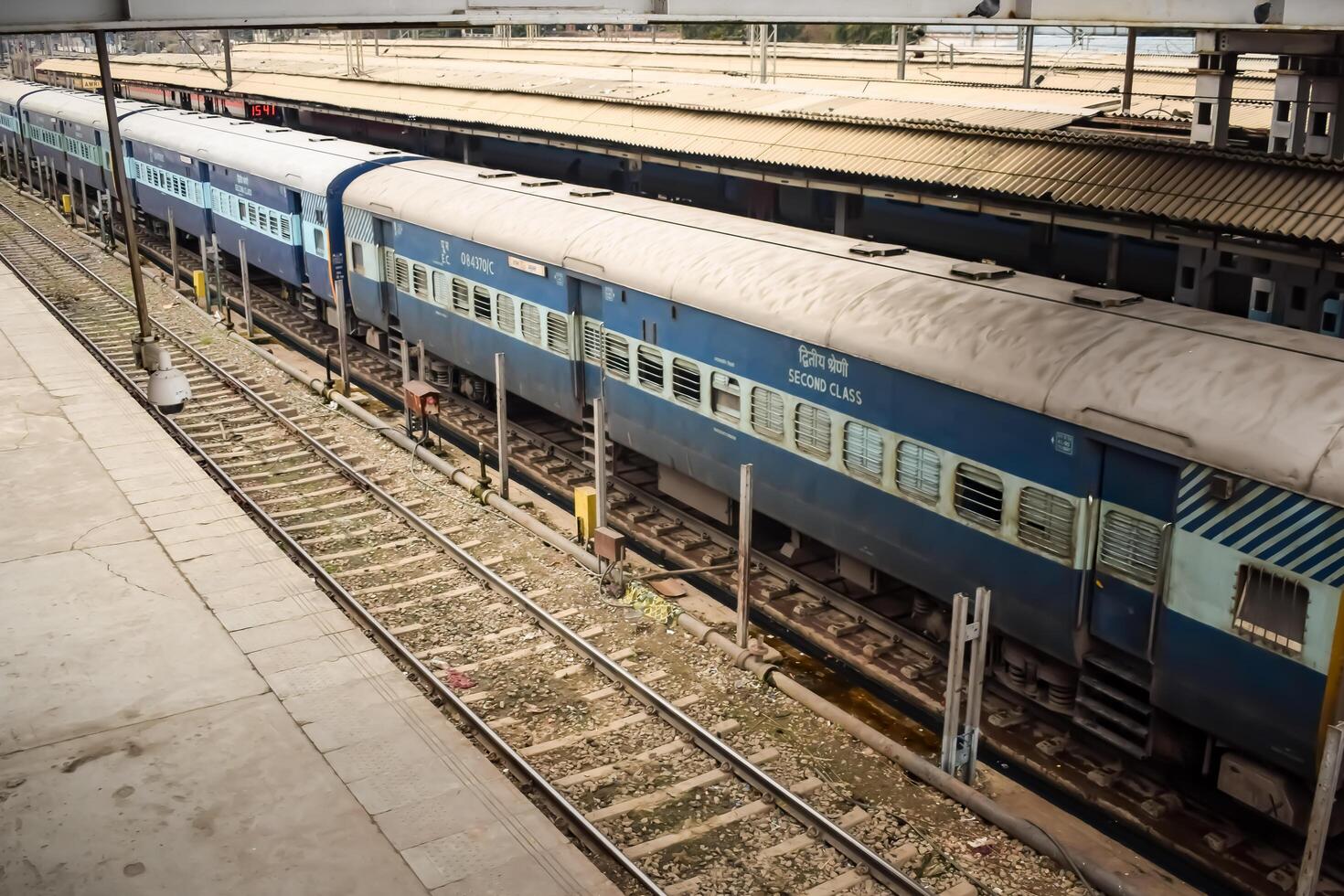 Amritsar, India, February 03 2024 - Indian railway train at Amritsar railway station platform during morning time, Colourful train at Amritsar, Punjab railway station photo