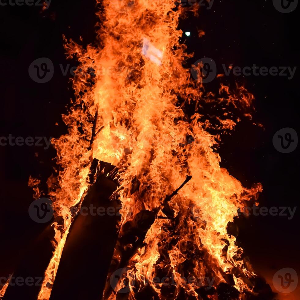 Fire flames on black background, Blaze fire flame texture background, Beautifully, the fire is burning, Fire flames with wood and cow dung bonfire photo