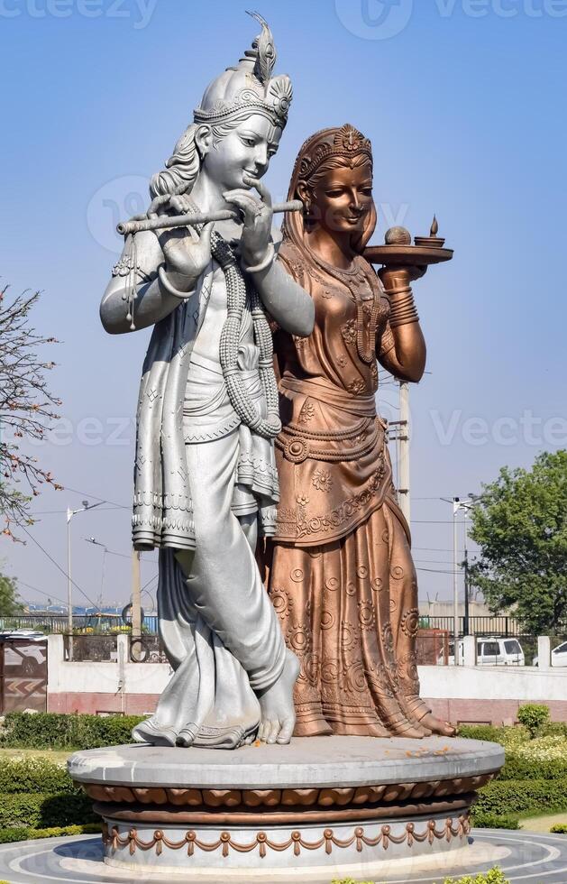 Big statue of Lord Radha Krishna near Delhi International airport, Delhi, India, Lord Krishna and Radha big statue touching sky at main highway Mahipalpur, Delhi photo