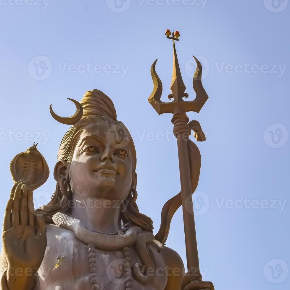 Big statue of Lord Shiva near Delhi International airport, Delhi, India, Lord Shiv big statue touching sky at main highway Mahipalpur, Delhi photo